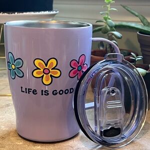 Life Is Good 22 oz travel mug with 3 daisy flowers, lavender in color